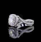 Angled top-side view emphasizing the brilliance of the cushion cut center stone and the interwoven diamond band.