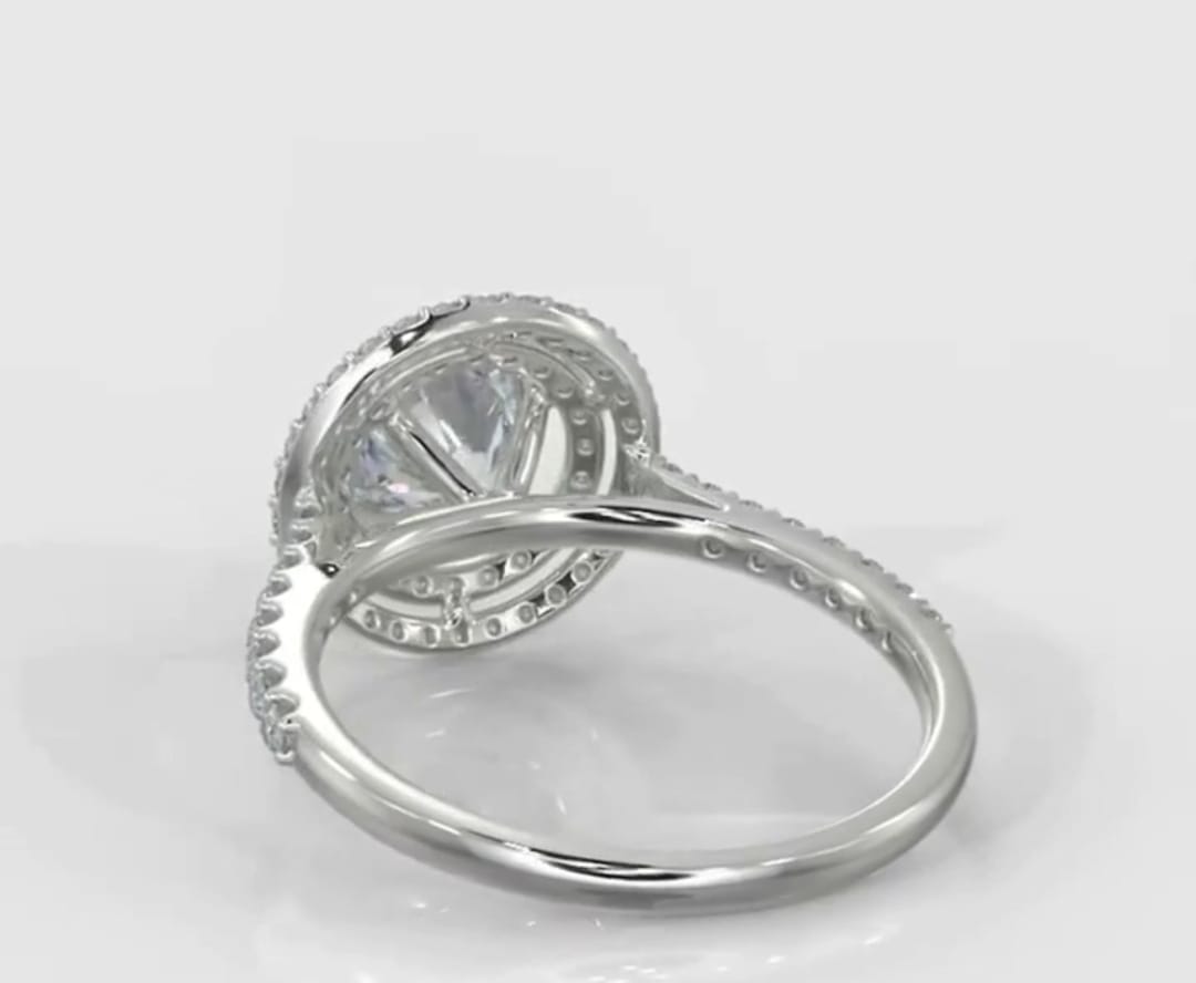 Back angle view of a 3 CT round cut lab grown diamond ring showing the double halo gallery structure and pave band.