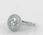 Angled top view of a white gold 3 carat round lab grown diamond engagement ring with a double halo setting.