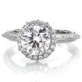 Front view of a 3 CT round lab grown diamond ring showing a brilliant halo and vintage inspired white gold band.
