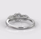 Back profile view of a three-stone lab grown diamond engagement ring highlighting the secure under-gallery.
