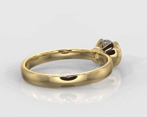 Angled back profile of a yellow gold 1.5 CT round lab grown diamond ring featuring a half-bezel setting.