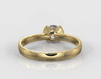Back view of a yellow gold engagement ring showing the open gallery of the half-bezel setting.