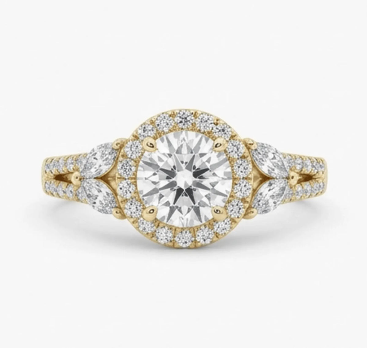Top-down view of a 2 CT round cut lab grown diamond featuring a diamond halo and marquise cut side stones in yellow gold.