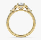 Side profile of a yellow gold round cut lab grown diamond engagement ring showing the prong setting and diamond band.