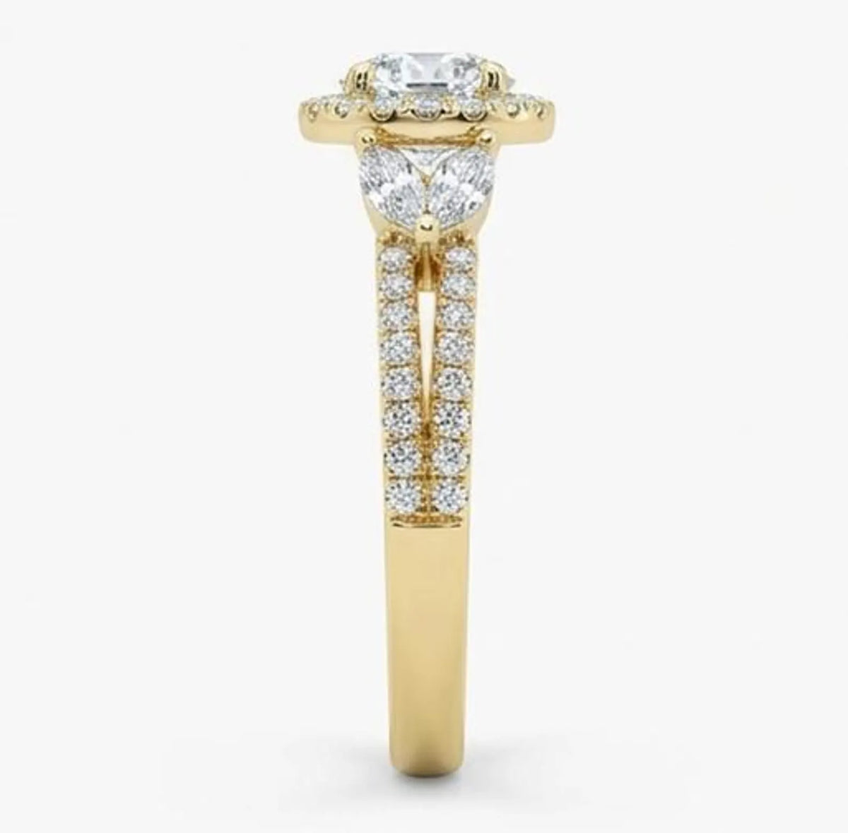 Close-up side view detailing the pave diamond split shank of a 2 carat round cut lab grown diamond engagement ring.