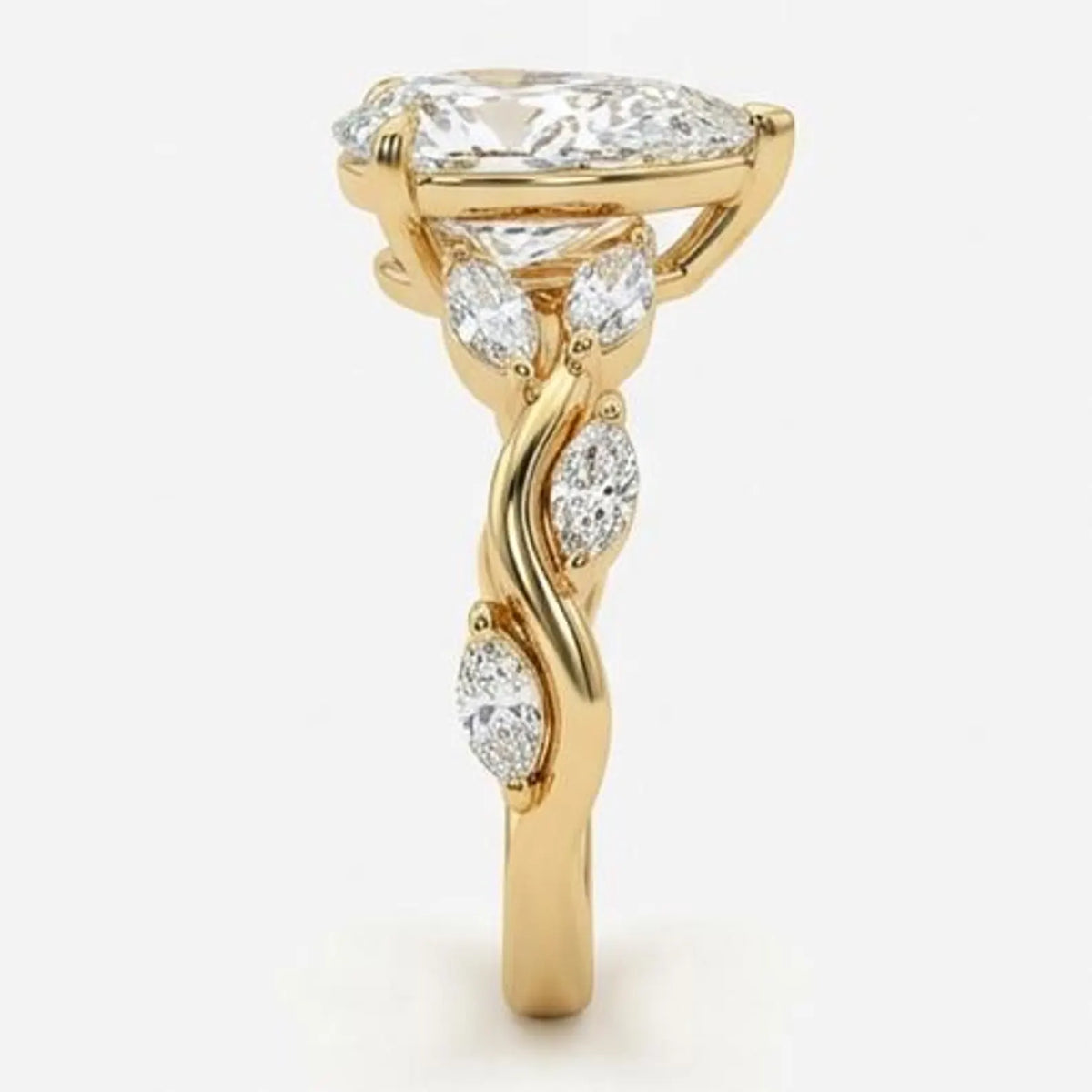 Side profile of a 3 CT pear cut lab grown diamond engagement ring highlighting the twisting vine band, diamond accents, and secure prong setting.