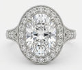 Top-down view of a 3 carat oval cut lab grown diamond halo engagement ring with vintage milgrain details.