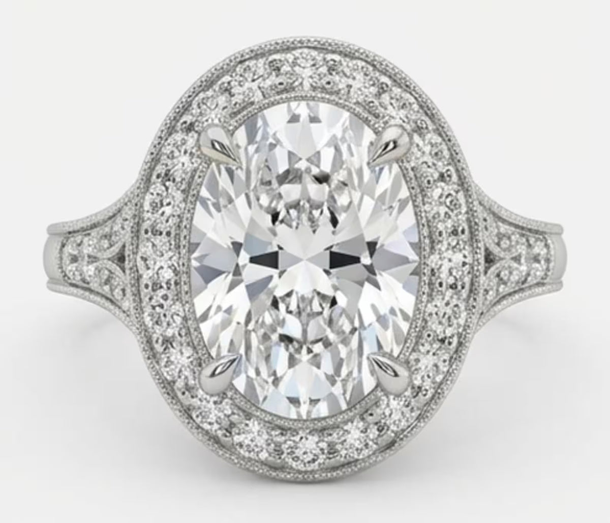 Top-down view of a 3 carat oval cut lab grown diamond halo engagement ring with vintage milgrain details.