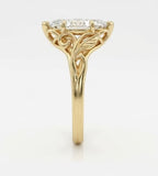 Side profile view of a marquise cut diamond ring showcasing intricate leaf filigree and vine detailing on the basket.