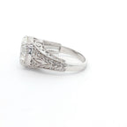 Side profile view of 4 CT round lab grown diamond ring with vintage leaf filigree and milgrain band.