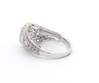Under-gallery openwork scroll detail on 4 carat round lab grown diamond engagement ring.