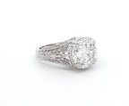 Angled view showing brilliant 4 CT round lab diamond set in a botanical leaf-detailed setting.