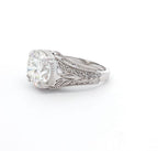 Perspective angle highlighting the intricate milgrain and leaf filigree pattern on white gold band.
