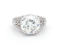 Top-down view displaying a brilliant 4 CT round lab grown diamond surrounded by leaf shoulders.