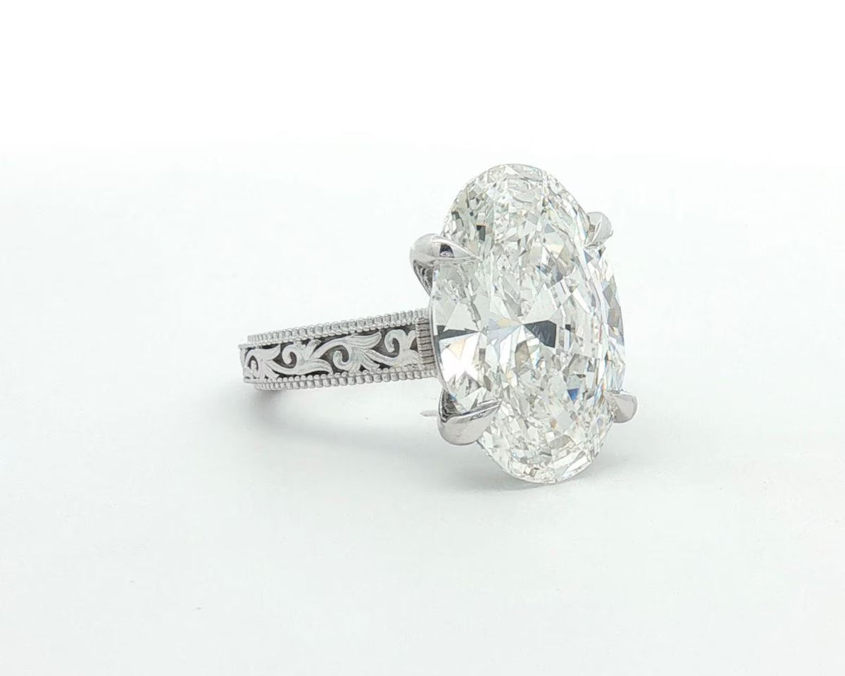 4 carat oval cut lab grown diamond ring with hand-engraved filigree band front angled view