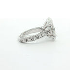 Side profile of 4 carat oval lab grown diamond engagement ring showing detailed scrollwork