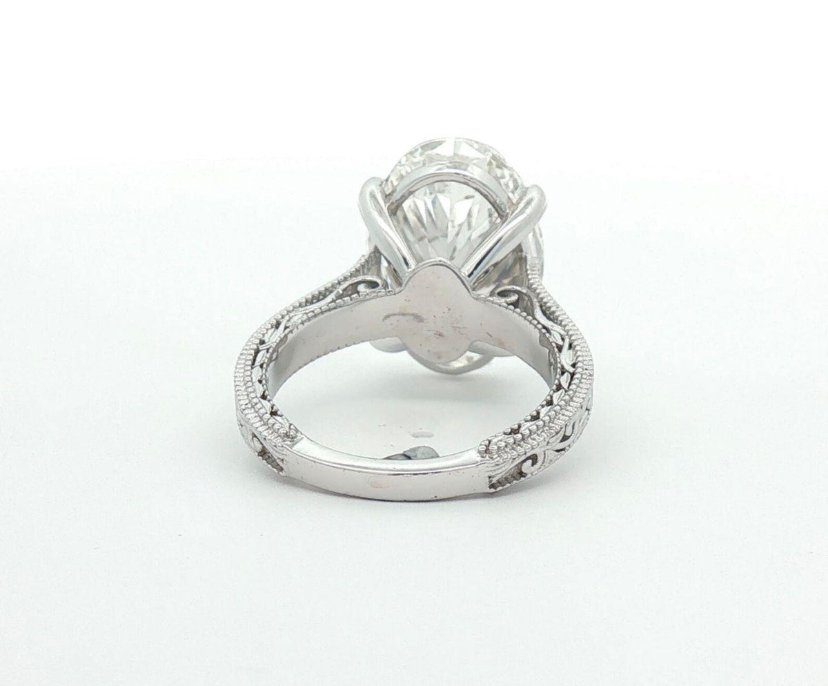 Rear bottom perspective of engraved ring band and secure prong base