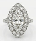 Top down view of 3 CT marquise cut lab grown diamond engagement ring with scalloped diamond halo