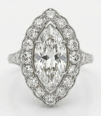 Top down view of 3 CT marquise cut lab grown diamond engagement ring with scalloped diamond halo