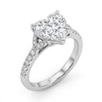 Angled view of 3 carat heart cut lab grown diamond engagement ring with botanical leaf accents and pavé band