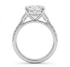 Side profile view of 3 CT heart lab grown diamond ring showing cathedral setting and basket prongs