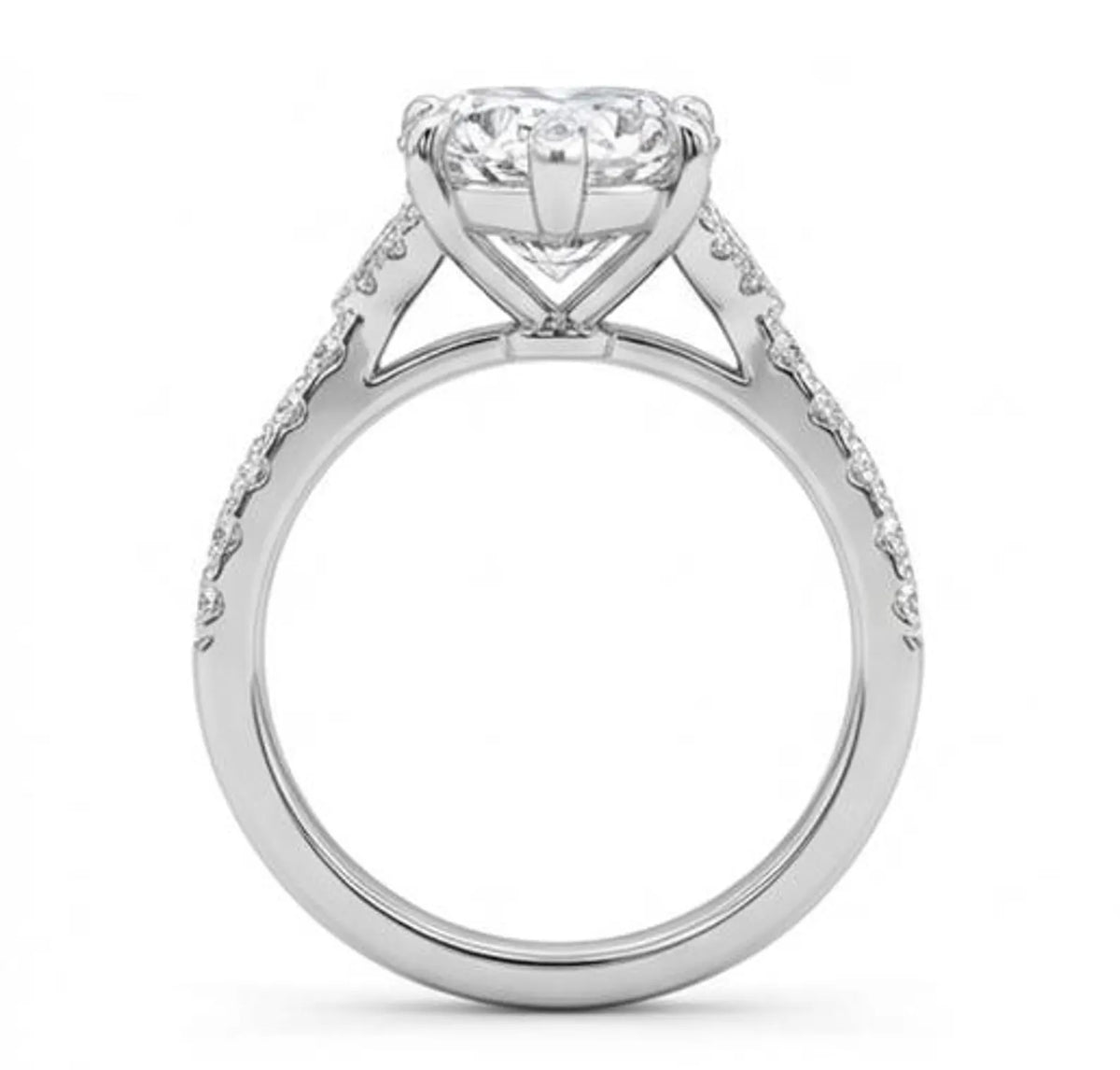 Side profile view of 3 CT heart lab grown diamond ring showing cathedral setting and basket prongs