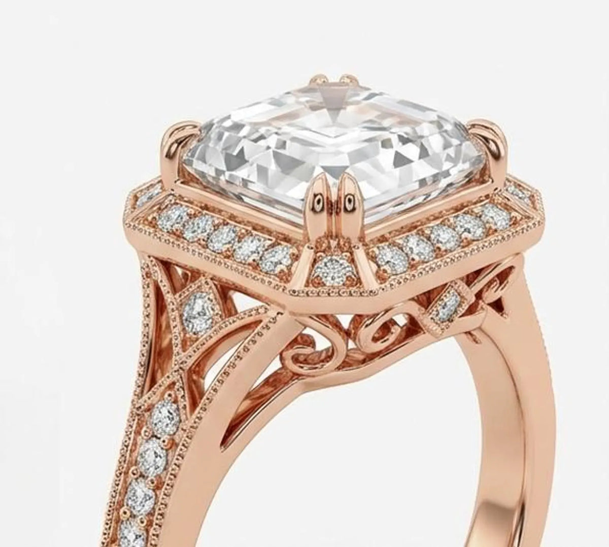 Close-up three-quarter view of asscher cut lab diamond showing claw prongs and intricate scrollwork