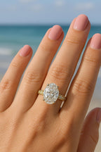 3 CT oval lab grown diamond vintage engagement ring worn on hand outdoors.