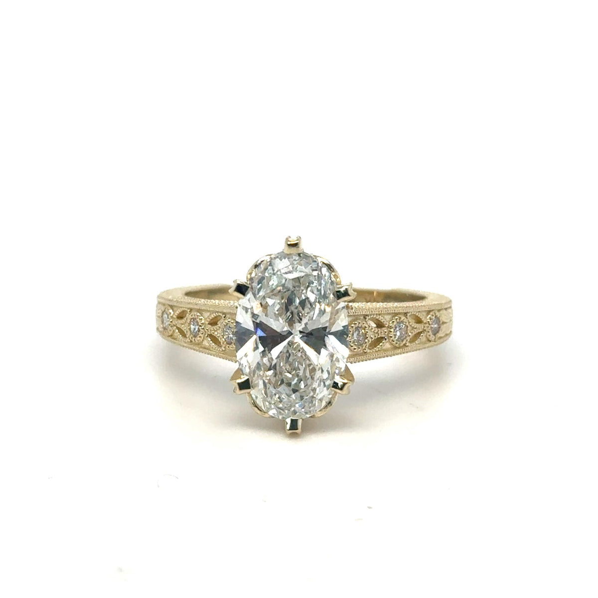 Front view of 3 CT oval cut lab grown diamond ring showcasing center stone and vintage band.