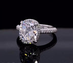 Front three-quarter view of a 3 CT elongated cushion cut lab grown diamond engagement ring with hidden halo.