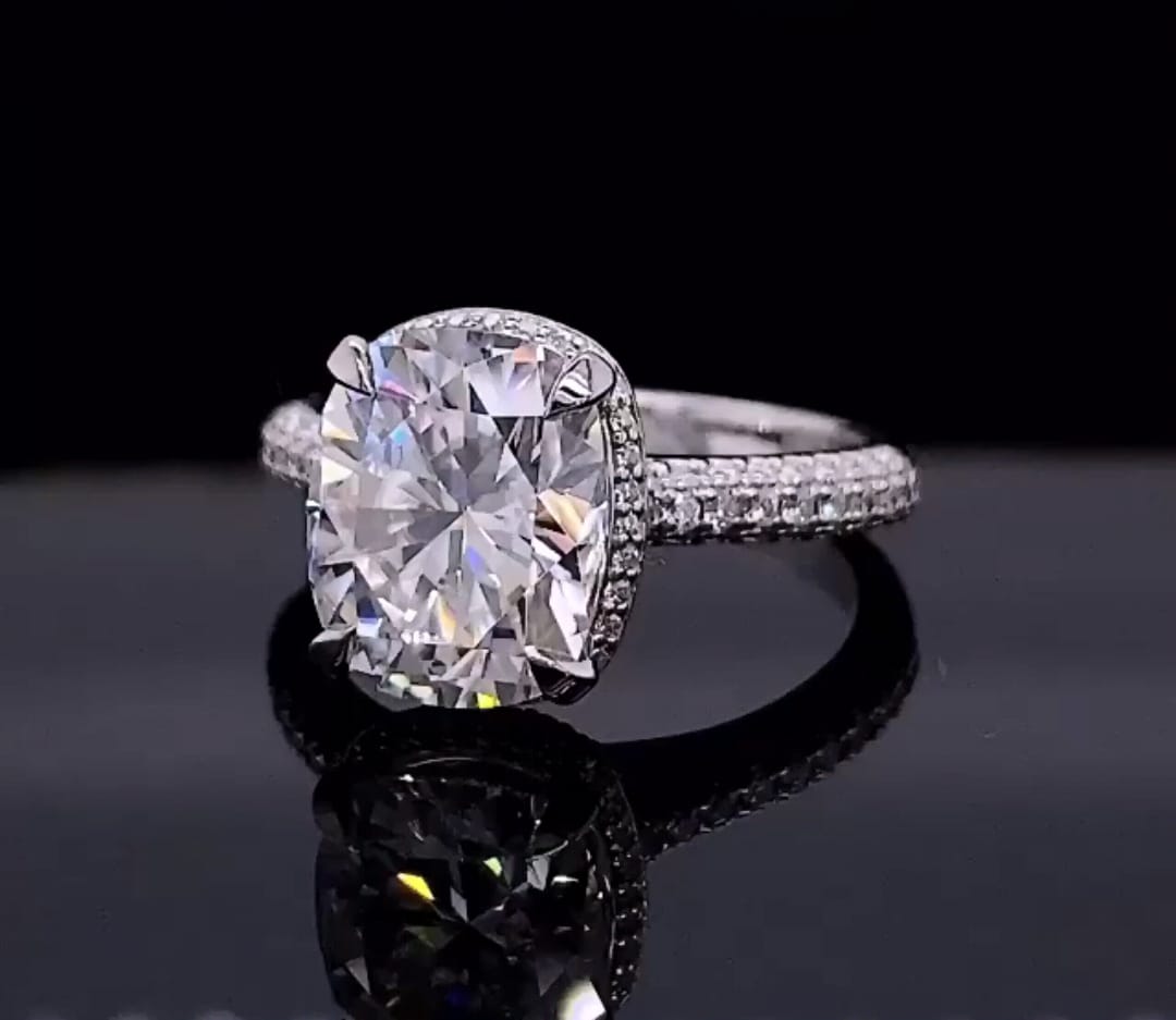 Front three-quarter view of a 3 CT elongated cushion cut lab grown diamond engagement ring with hidden halo.