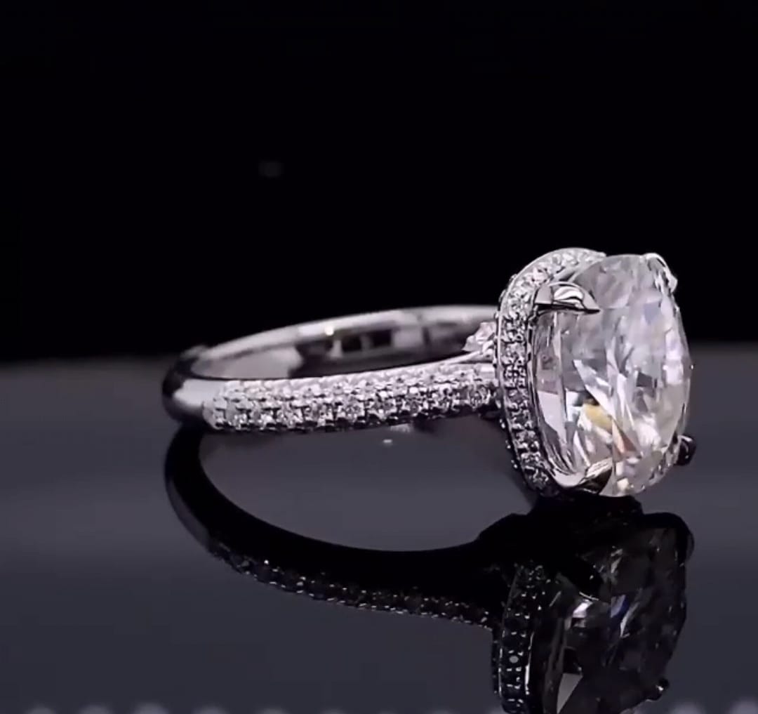 Side angle view showing multi-row micro-pavé diamond band on a cushion cut lab grown diamond ring.