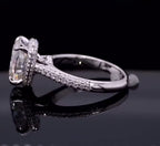 Side profile displaying bridge structure and hidden halo setting of a 3 CT cushion cut diamond ring.