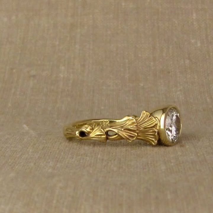 Side view showcasing the 18K gold hallmark stamp inside the botanical bezel diamond band.
