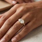 3 CT horizontal oval cut lab grown diamond bezel engagement ring worn on hand.