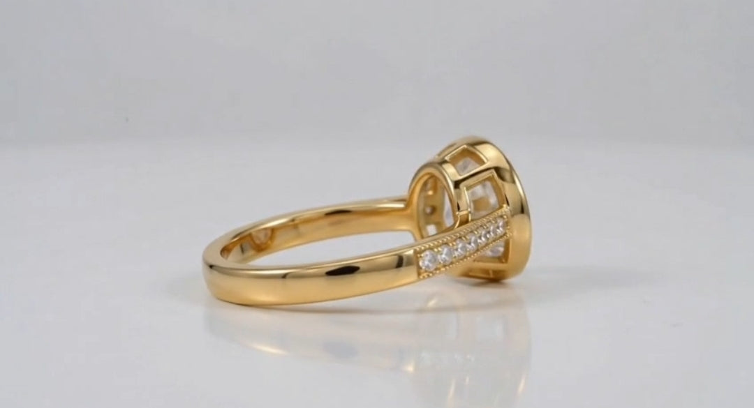 Profile view showing open gallery under bezel setting of 3 CT oval lab diamond ring.