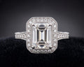 Top view of 3 CT emerald cut lab grown diamond ring with vintage milgrain halo setting in white gold.