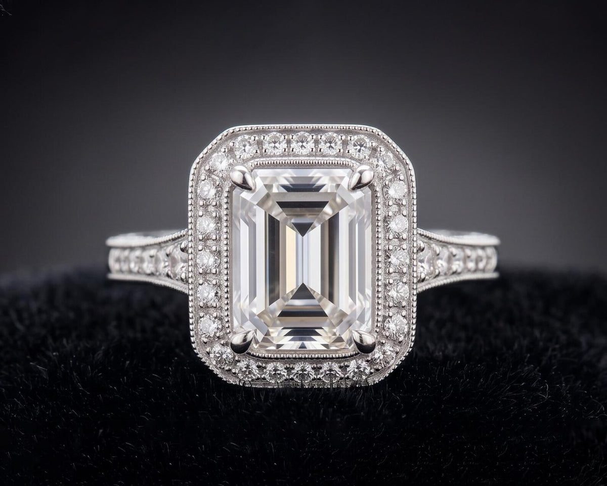 Top view of 3 CT emerald cut lab grown diamond ring with vintage milgrain halo setting in white gold.