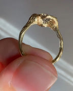 Side profile of 4 carat oval lab grown diamond ring with organic textured gold setting