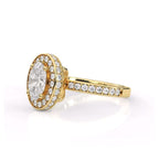 Angled view of 2ct oval lab diamond halo ring showcasing pave accent setting in yellow gold