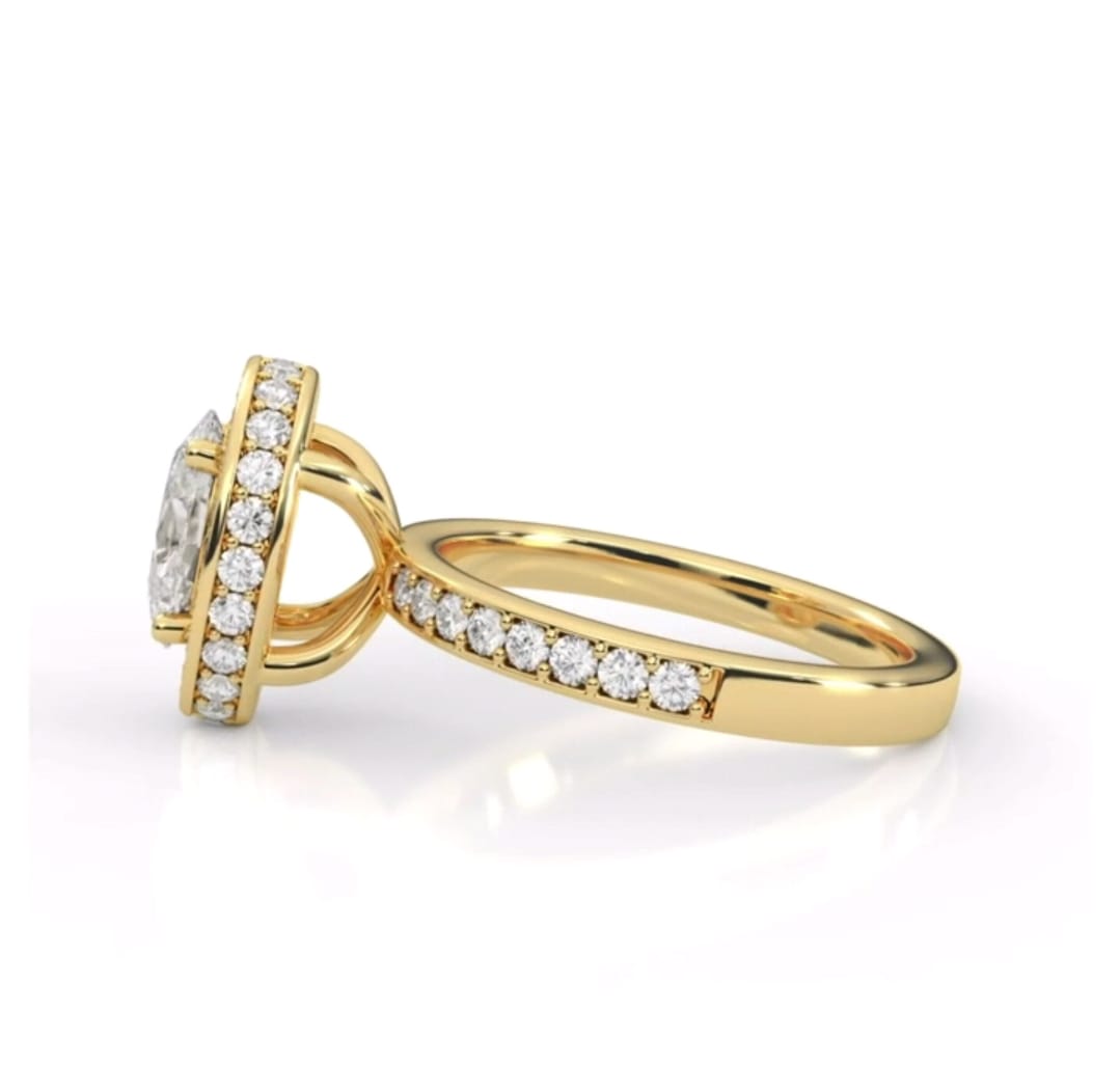Side profile of 2 carat oval diamond halo ring displaying under-basket and pave shank