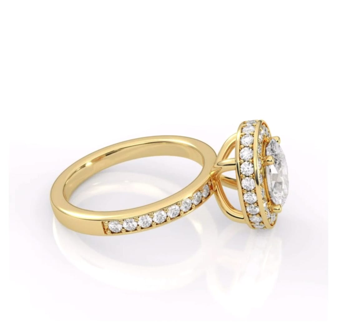 Three-quarter side view of yellow gold 2ct oval lab diamond ring with pave side detailing