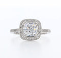 Top view of 3 CT cushion cut lab grown diamond engagement ring with vintage milgrain halo and pave diamond band.