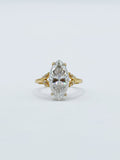 Front studio view of a 3 CT marquise cut lab grown diamond ring with gold leaf-inspired accent shoulders.