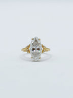 Front studio view of a 3 CT marquise cut lab grown diamond ring with gold leaf-inspired accent shoulders.