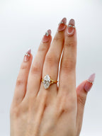 Direct angle of 3 CT marquise lab grown diamond ring showcasing the elongating effect on the finger.