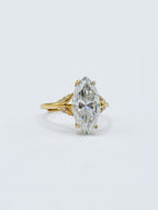 Three-quarter studio perspective of 3 CT marquise cut lab grown diamond ring highlighting leaf-shaped pave side accents.