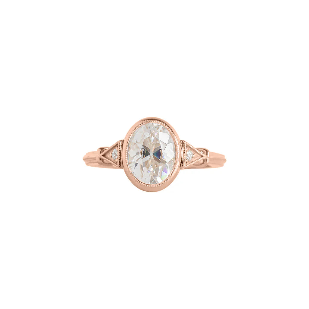 Top view of rose gold 2 CT oval cut lab diamond ring with triangular milgrain side accents.