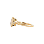 Three-quarter side angle of yellow gold 2 CT oval lab diamond engagement ring highlighting shoulder detail.